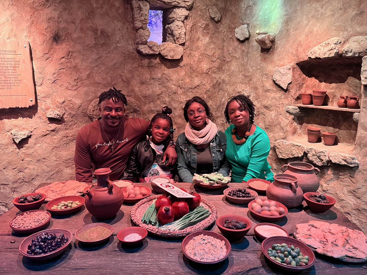 Nina with Moretti and their daughters, together at a table
